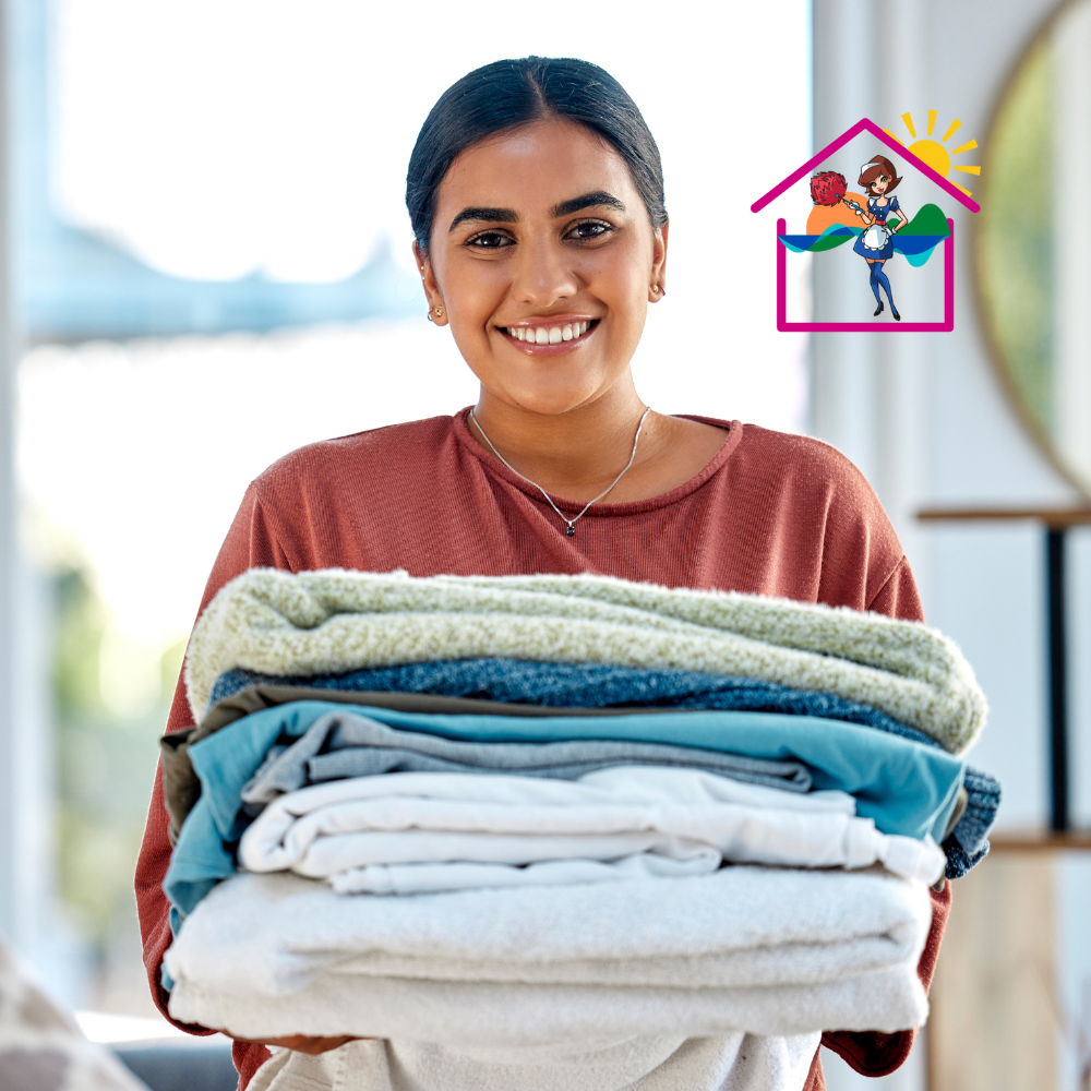 House cleaning Surf coast 6 Young lady holding fresh Airbnb linen and smiling with sunny back ground
