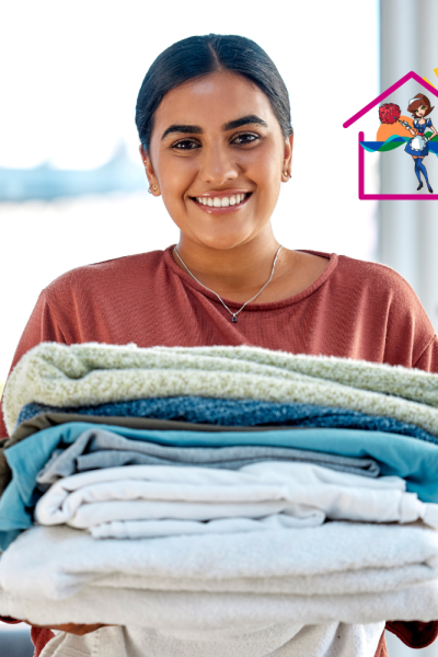 Young lady holding fresh Airbnb linen and smiling with sunny back ground